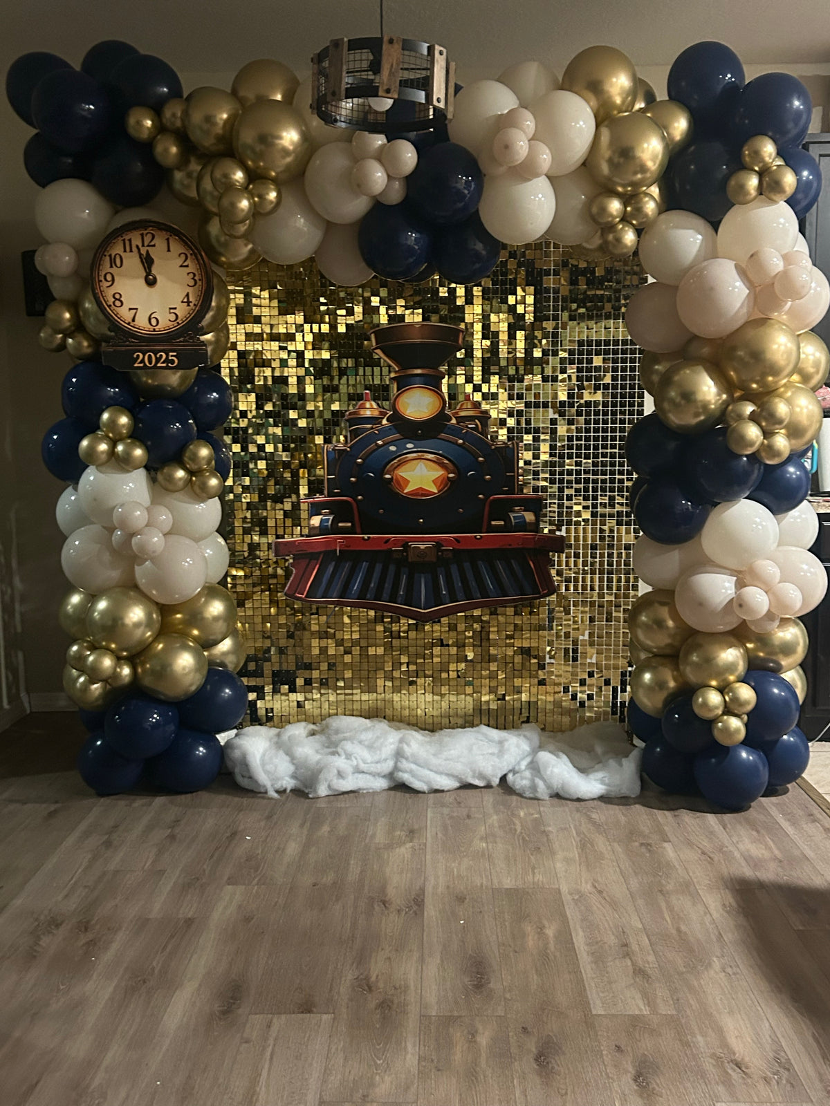 Train party decoration with navy white and gold balloons and full gold sequin wall. Train cutout is an optional add-on.