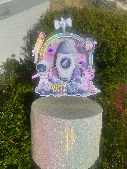 Astronaut-themed birthday cake topper for a "Over the Moon" first trip around the sun first birthday party.