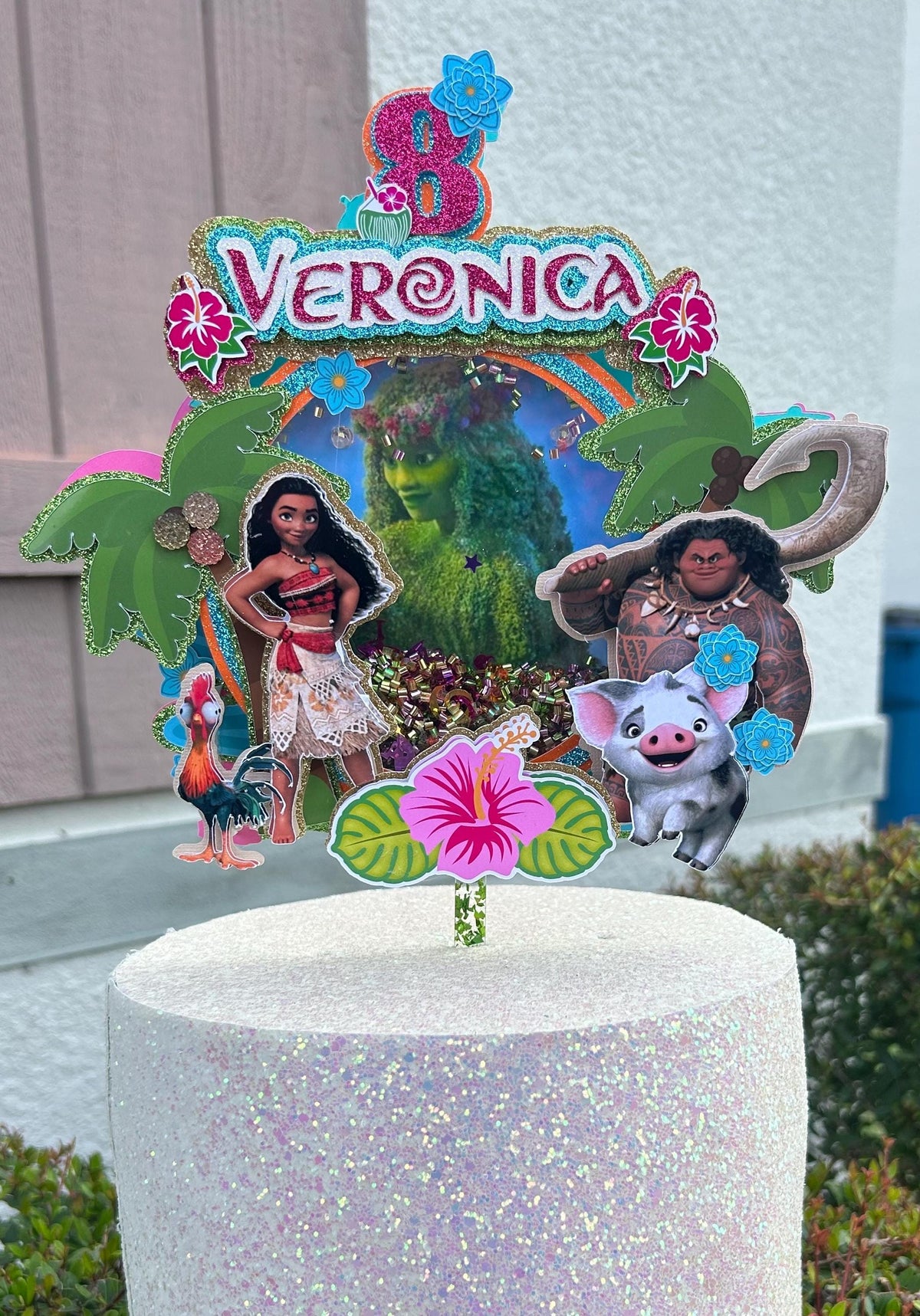Personalized Veronica tropical cake topper with age eight, island background, palm trees, flowers, girl, demigod, pig, and rooster.