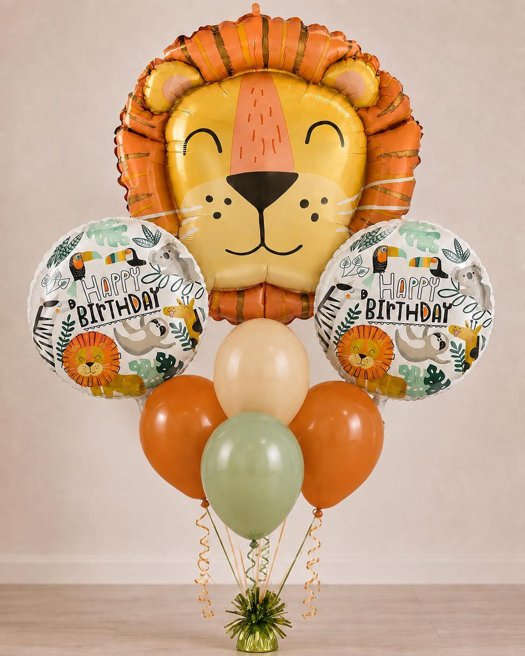 Lion face safari birthday balloon bouquet with orange, cream and green latex balloons