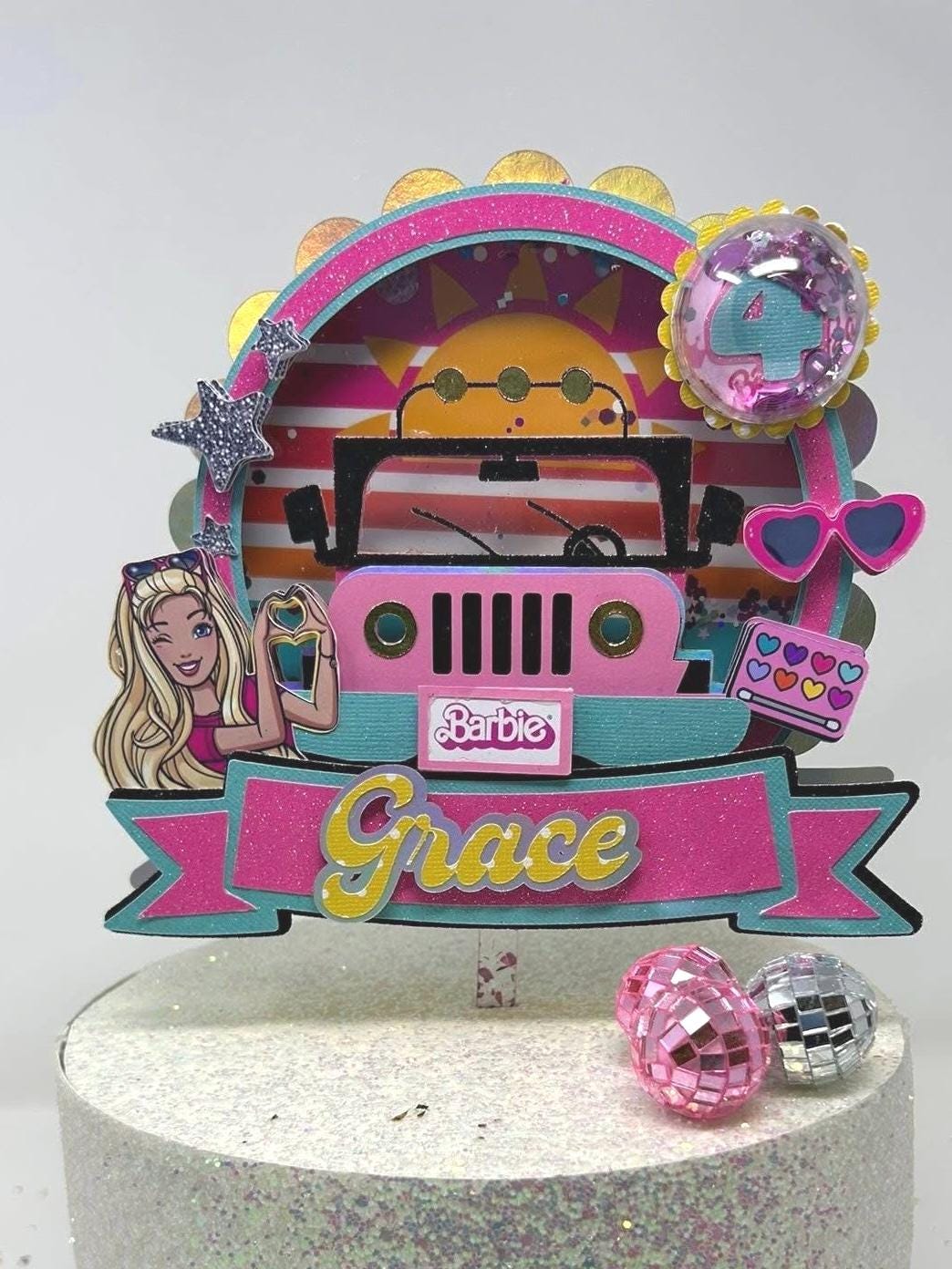Personalized Grace fashion doll Jeep cake topper with age four, pink and aqua vehicle, heart glasses, makeup details, and stars.